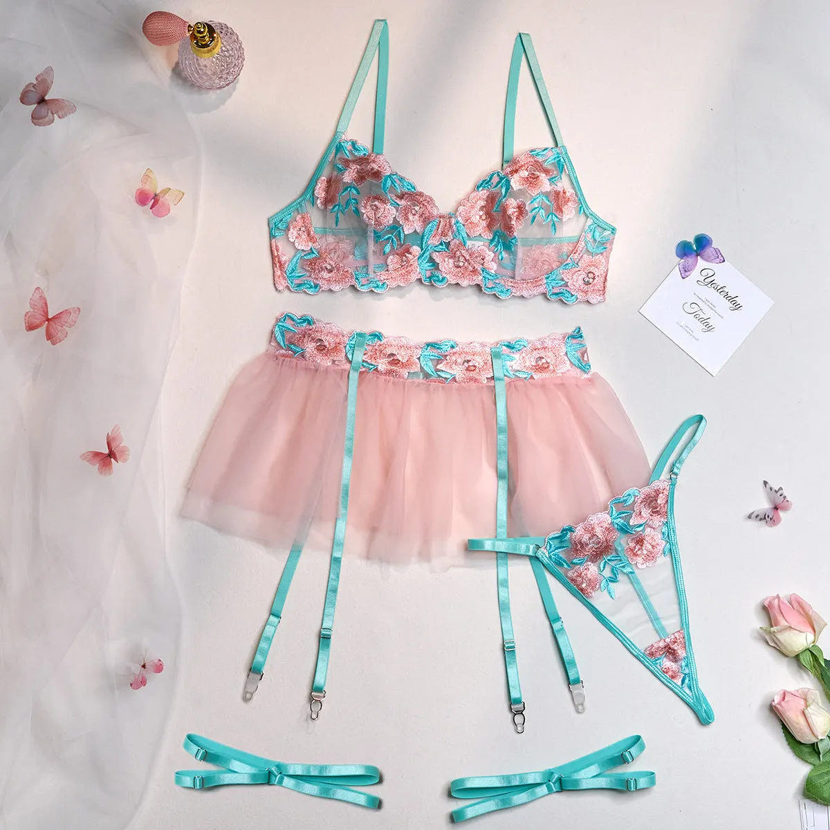 Pink women's embroidered mesh pettiskirt lingerie suit with matching bikini.