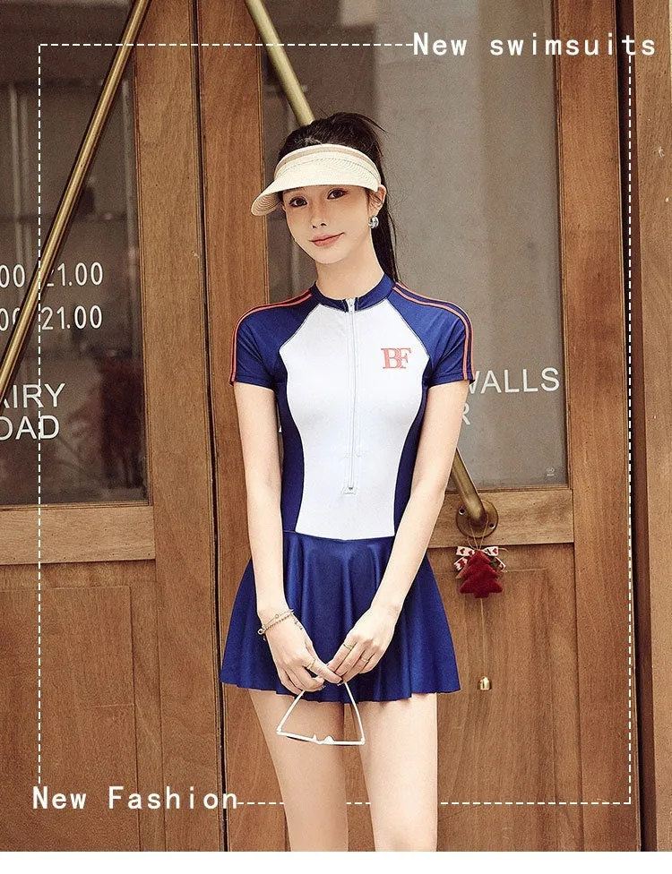 Conservative women's sports one-piece swimsuit in a colour-block pattern, shown in colour E92 or E93.