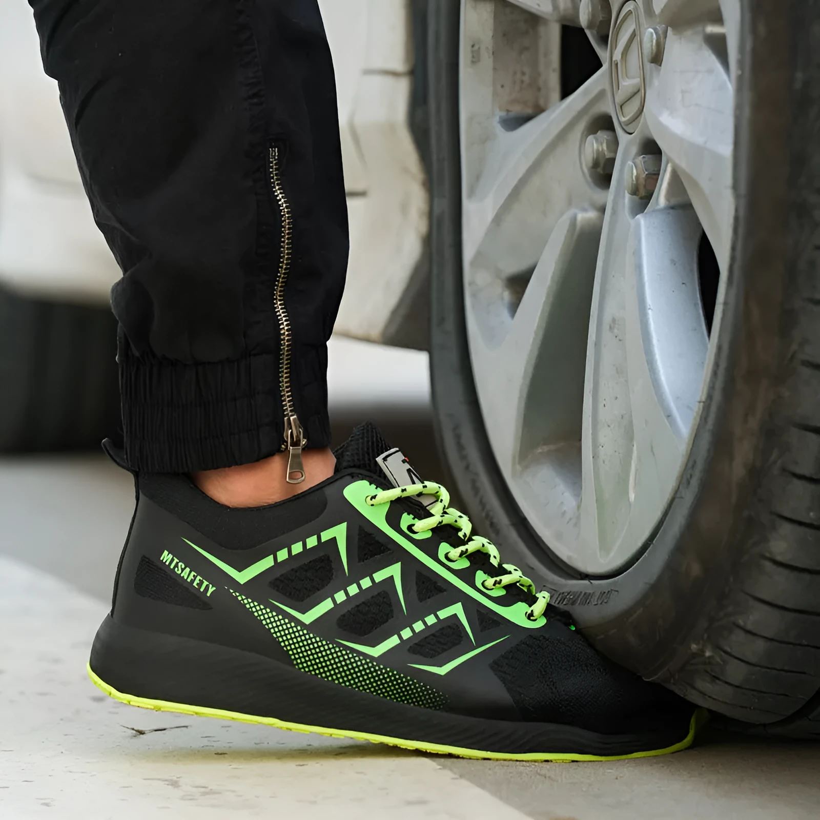 Black ultra-light safety work shoes with a steel toe cap and lace-up front.