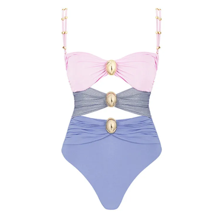 Green women's one-piece swimsuit with round buckle decoration and hollow out stitching on nylon fabric.