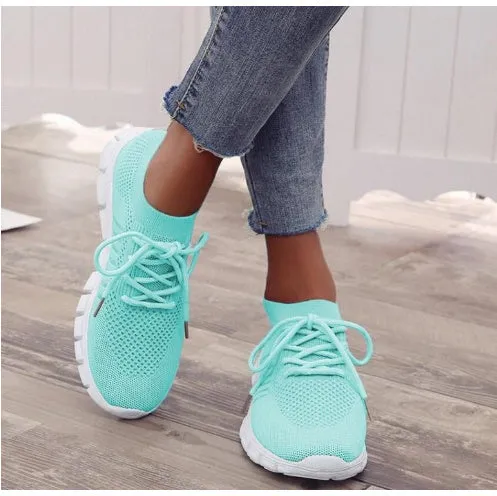 Women's breathable high-top lace-up platform sneaker in various colours on a casual background.
