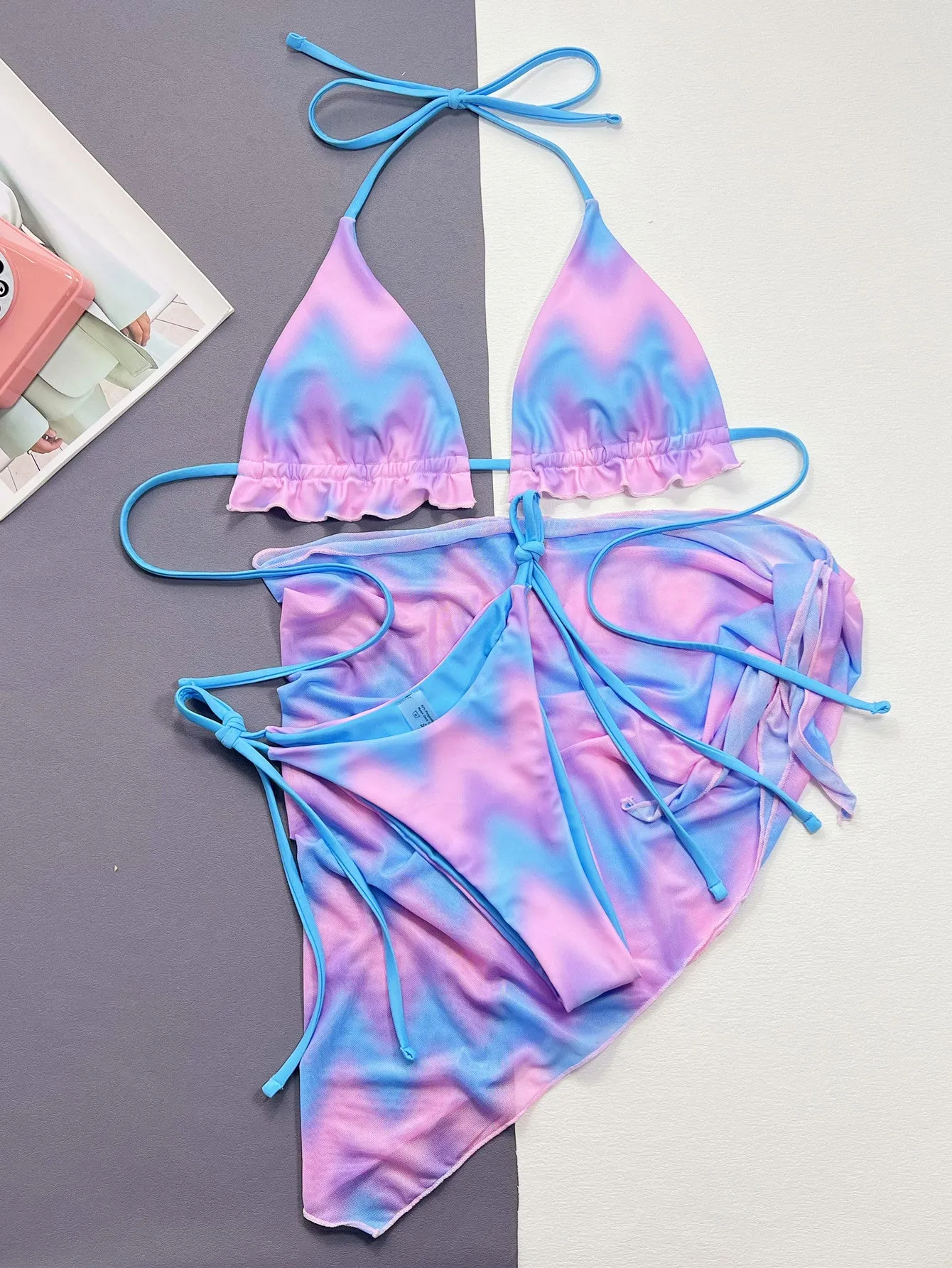 Women's tie-dye bikini swimsuit with split-front design and matching bra and briefs