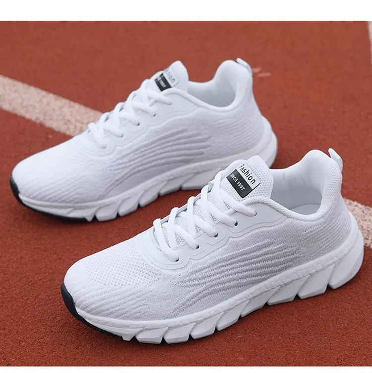 Women's black and white casual running sneakers with cross strap design and MD sole
