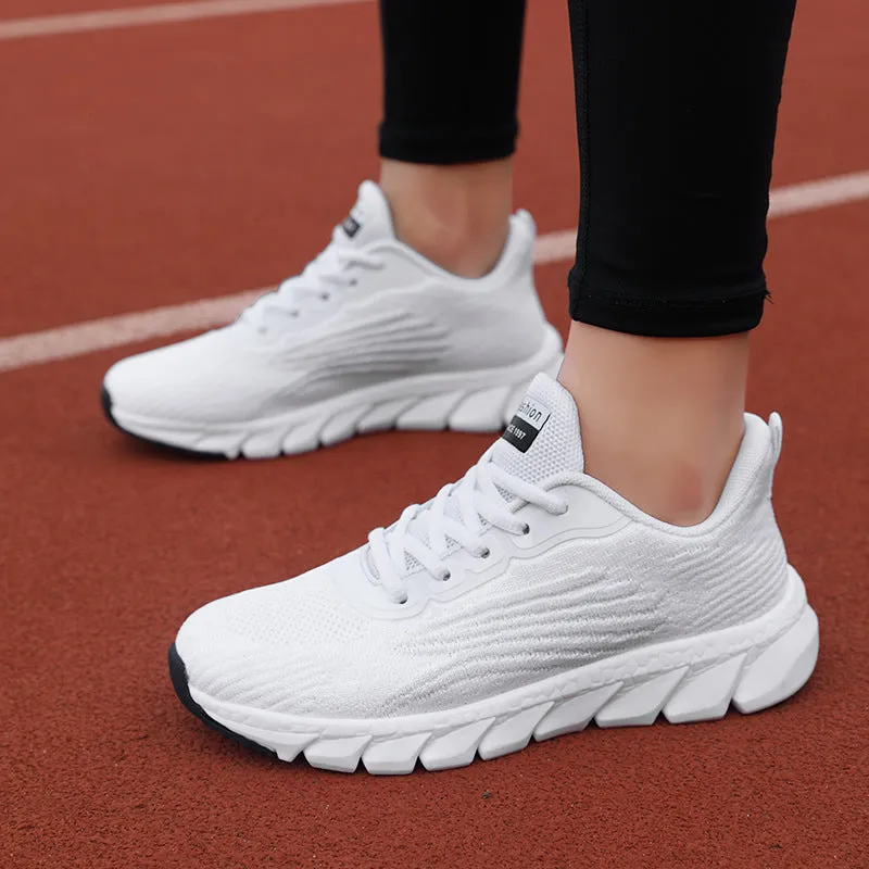 Women's black and white casual running sneakers with cross strap design and MD sole