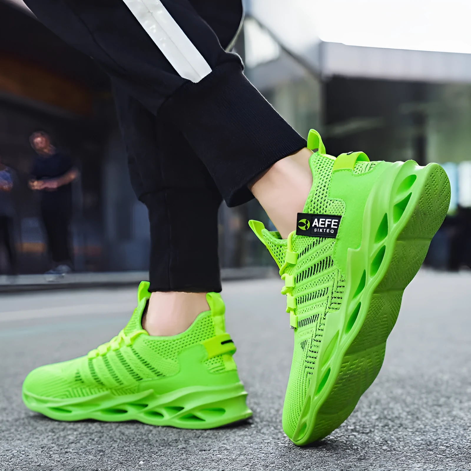 Men's black mesh casual running shoes with cross-strap design and low-top profile