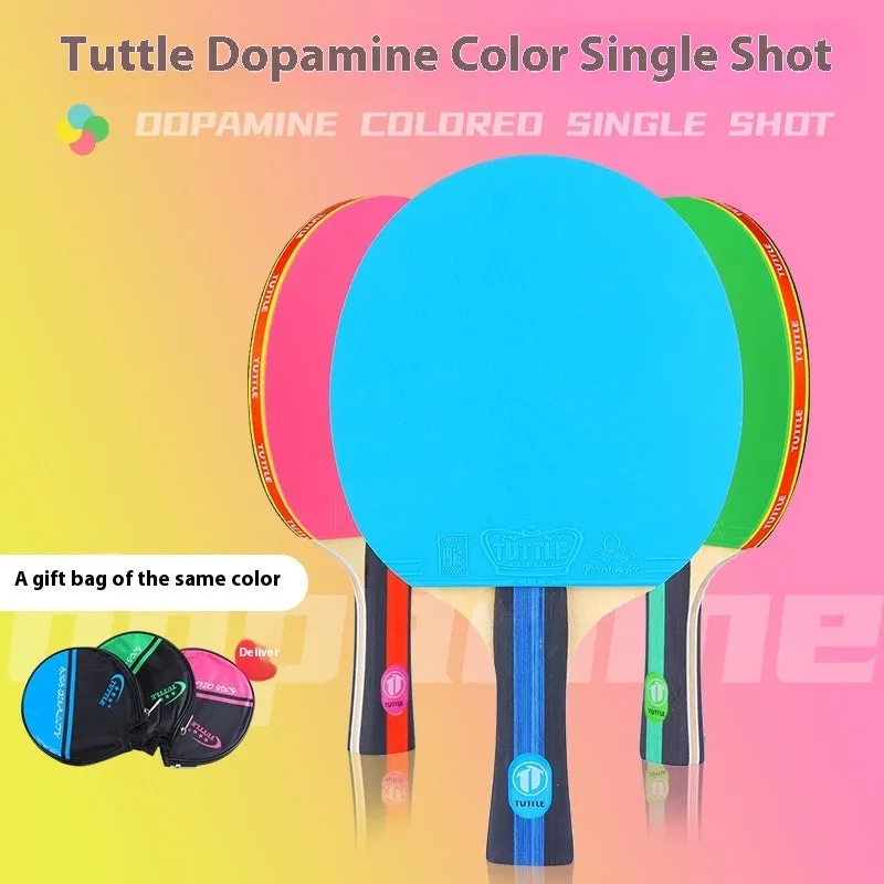 A pink pure wood table tennis racket with a long shakehand grip handle next to its matching protective cover.