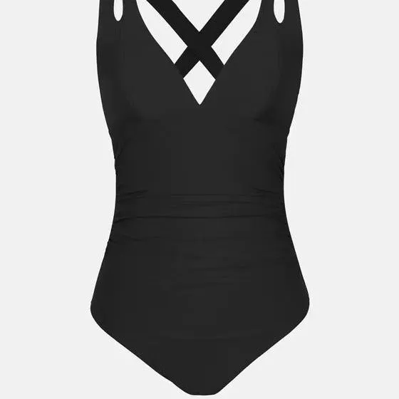 Women's solid colour one-piece swimsuit with bikini triangle top and cross shoulder straps.