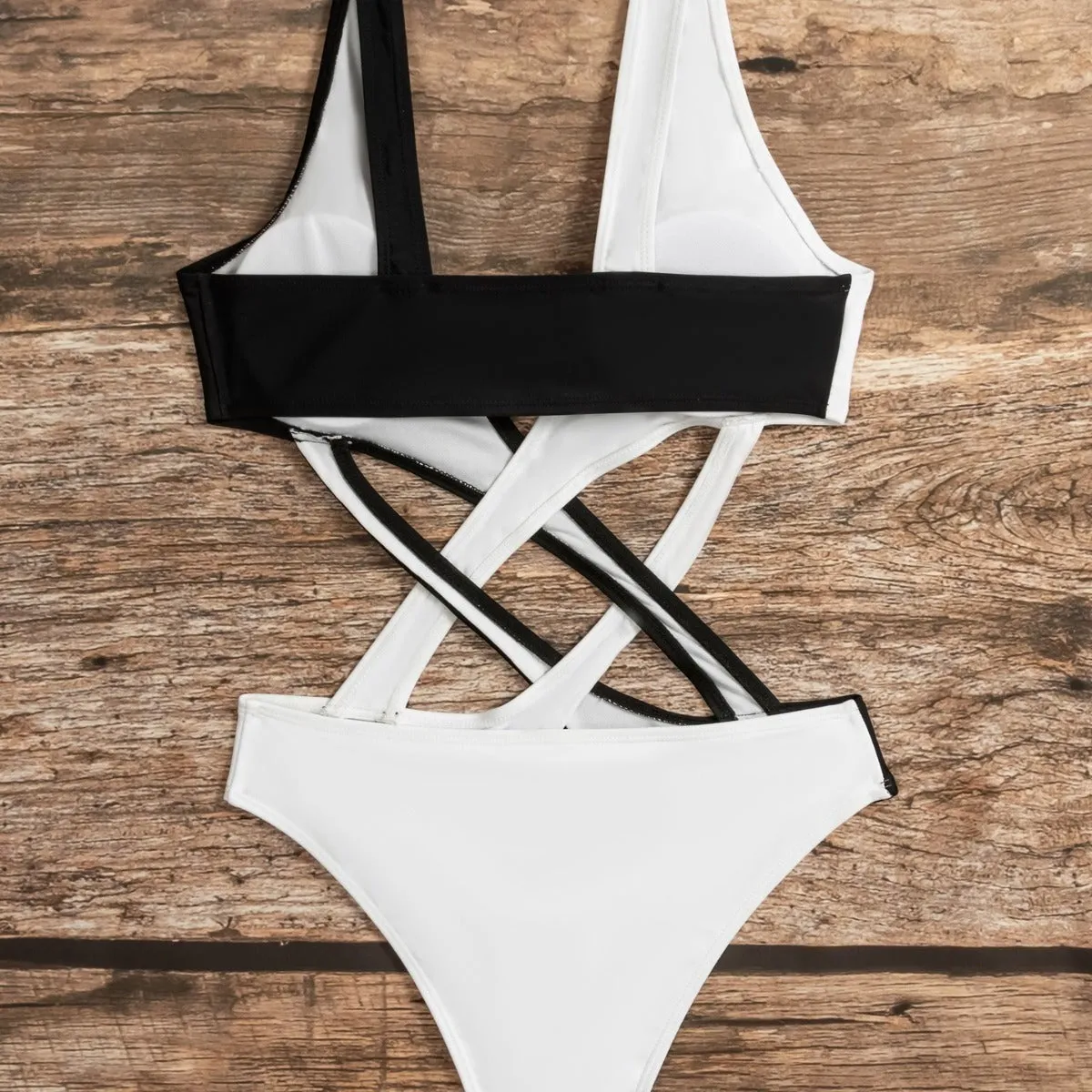 White women's one-piece swimsuit with colour blocking pattern and hollow-out detailing