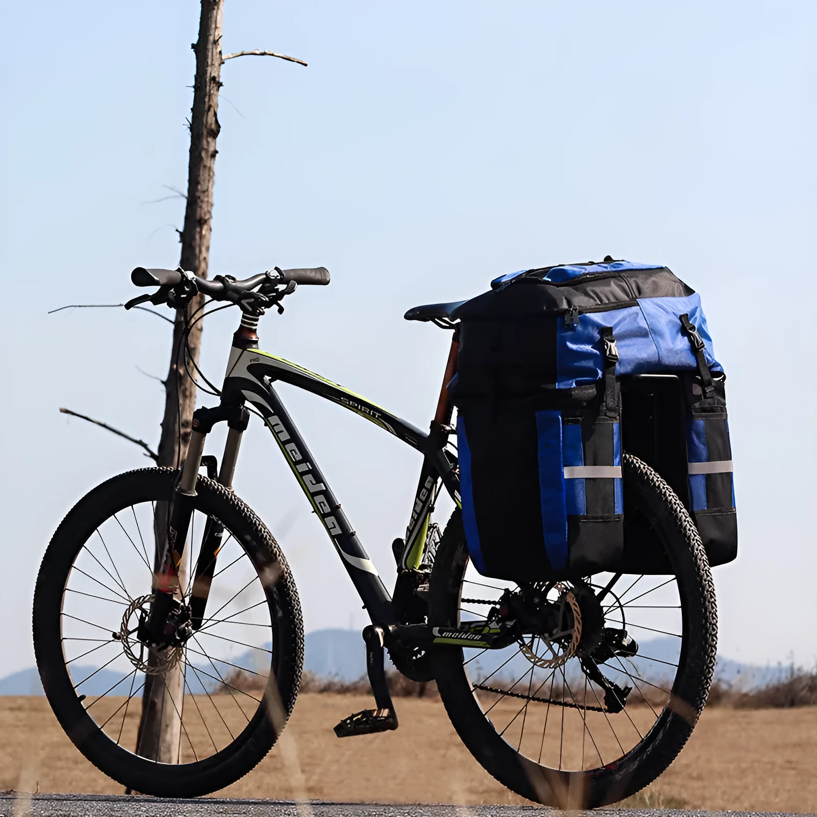 Rhinoceros 70-litre green bicycle rear storage bag mounted on a bike rack for touring.
