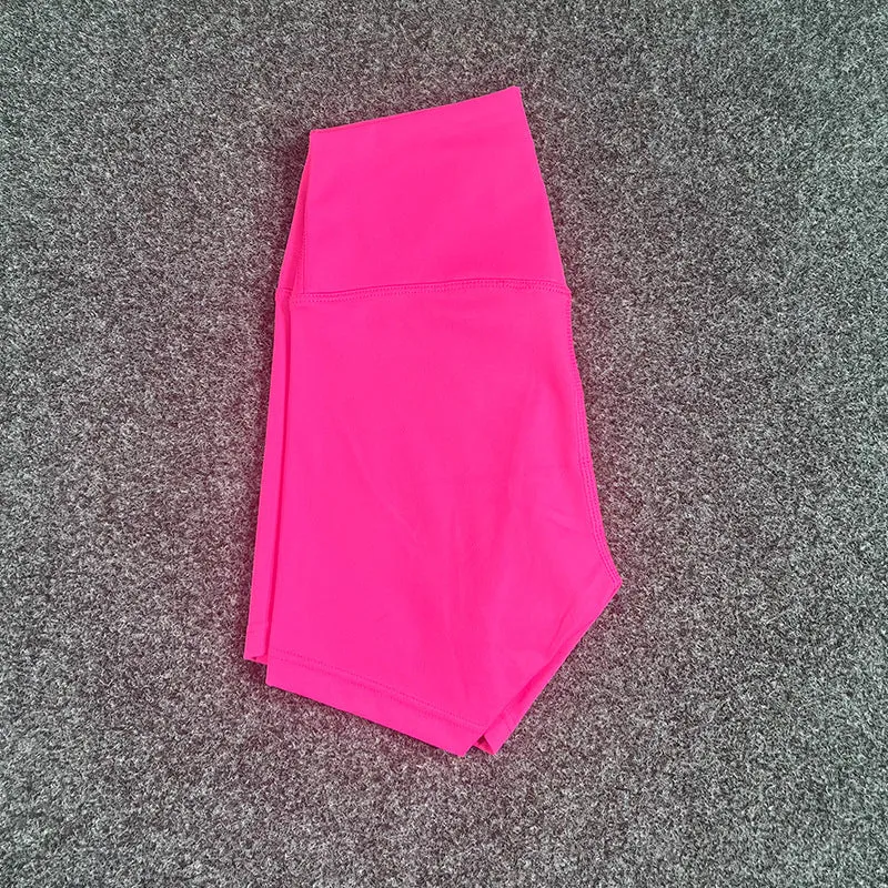 Women's high-waisted nylon yoga shorts in a selection of colours on a neutral background.