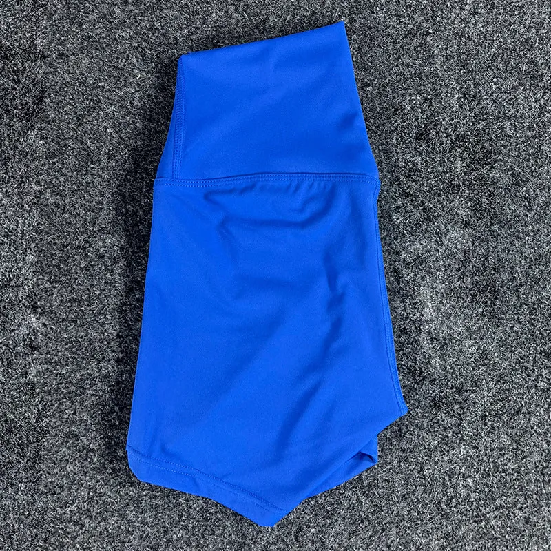 Women's high-waisted nylon yoga shorts in a selection of colours on a neutral background.