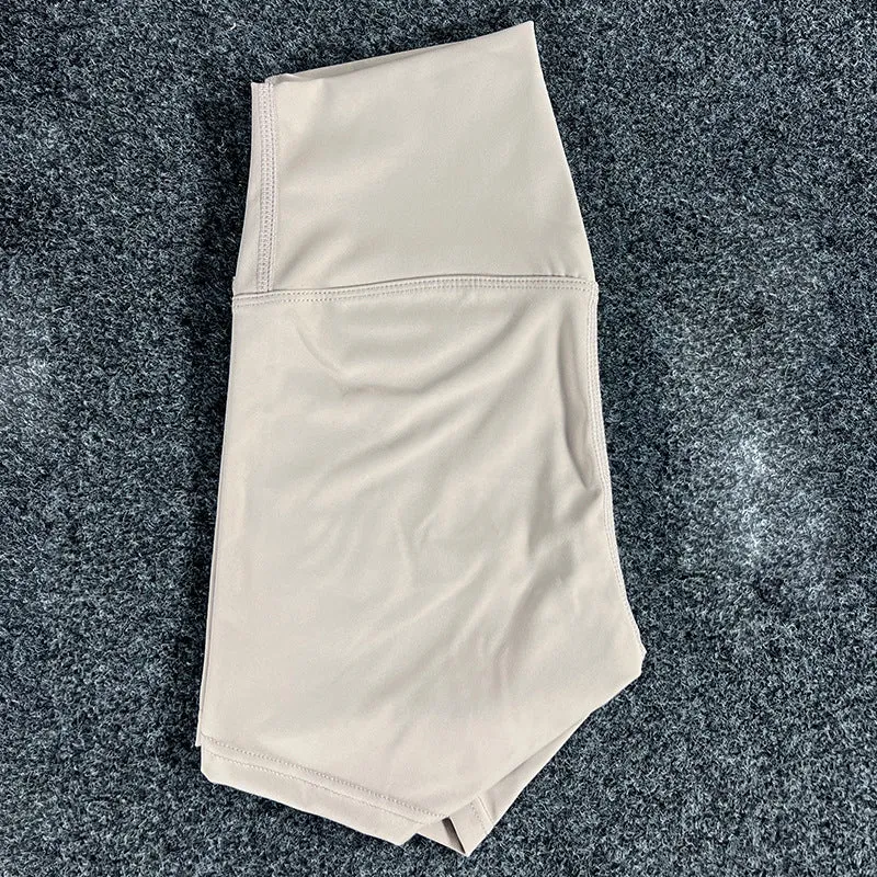 Women's high-waisted nylon yoga shorts in a selection of colours on a neutral background.
