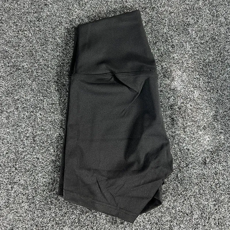 Women's high-waisted nylon yoga shorts in a selection of colours on a neutral background.