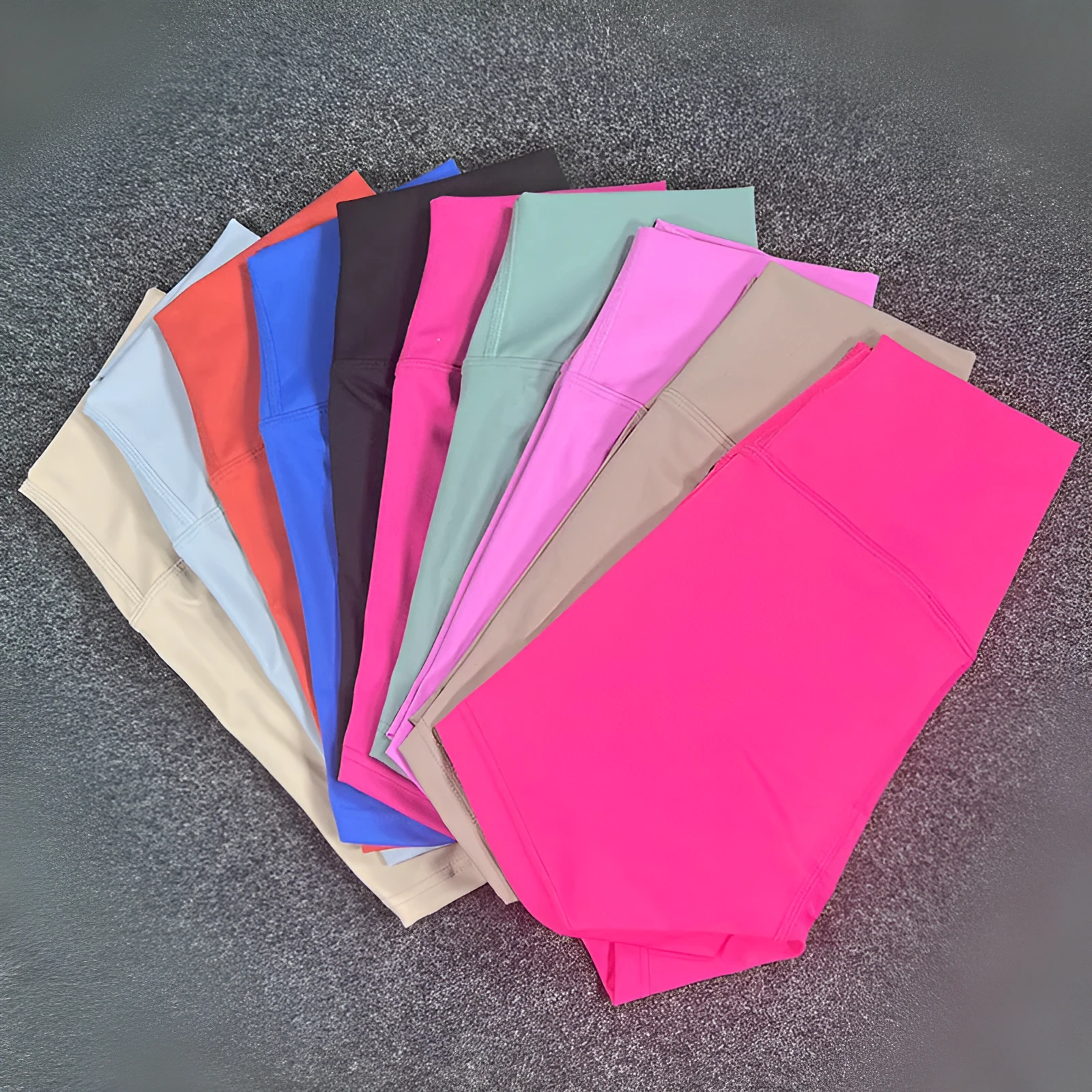Women's high-waisted nylon yoga shorts in a selection of colours on a neutral background.