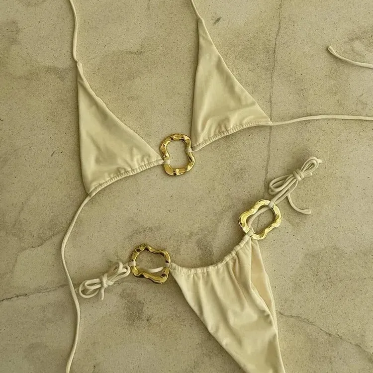 Women's halter neck bikini with lace-up front and low-waist briefs in solid colour