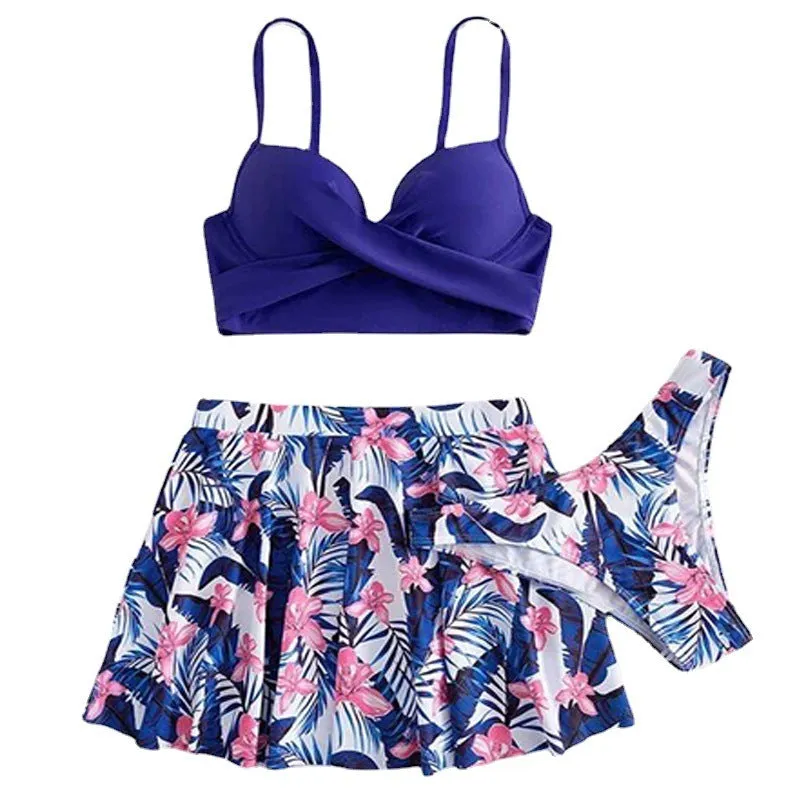 Women's three-piece bikini set with high-waist briefs providing belly coverage in polyester fabric