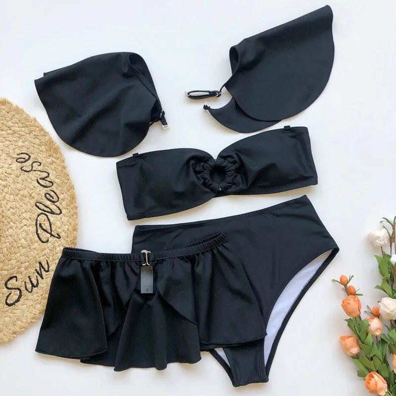 Women's red and black three-piece flounced bikini swimsuit on a hanger.