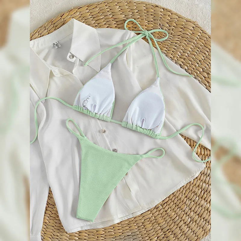 Women's lace up bikini swimsuit in multiple colours on a mannequin, showing front and back design
