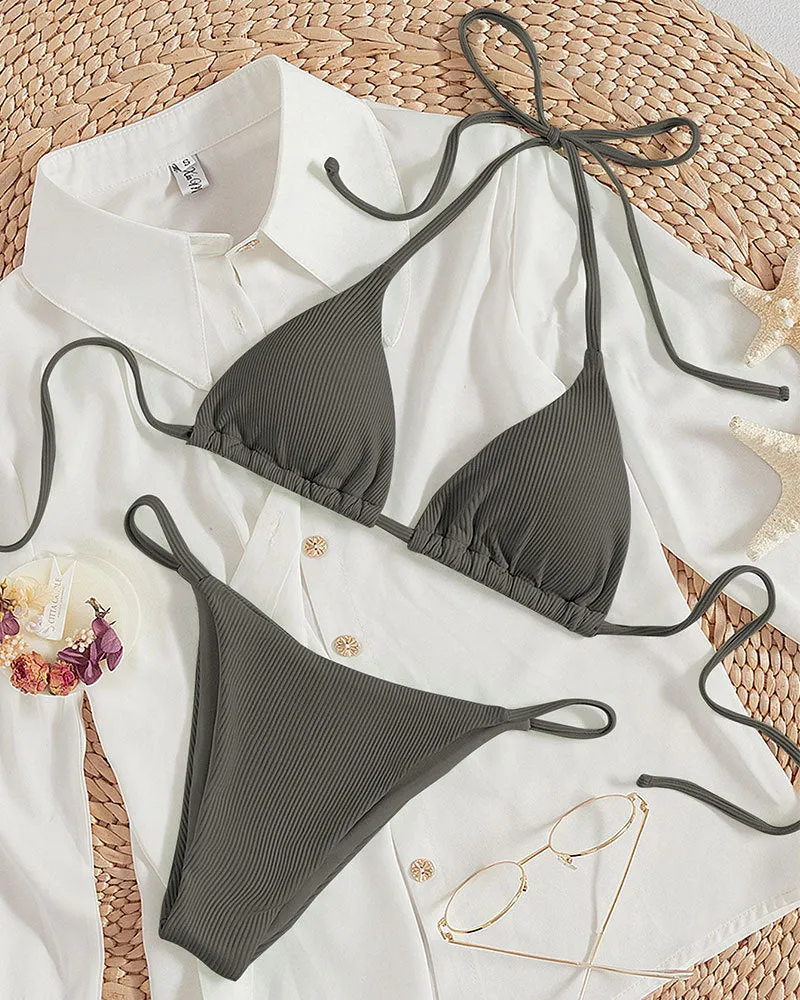 Women's lace up bikini swimsuit in multiple colours on a mannequin, showing front and back design