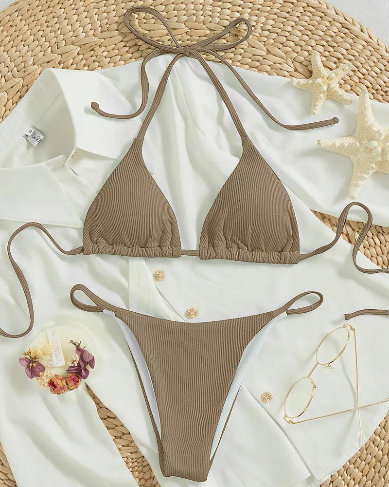 Women's lace up bikini swimsuit in multiple colours on a mannequin, showing front and back design
