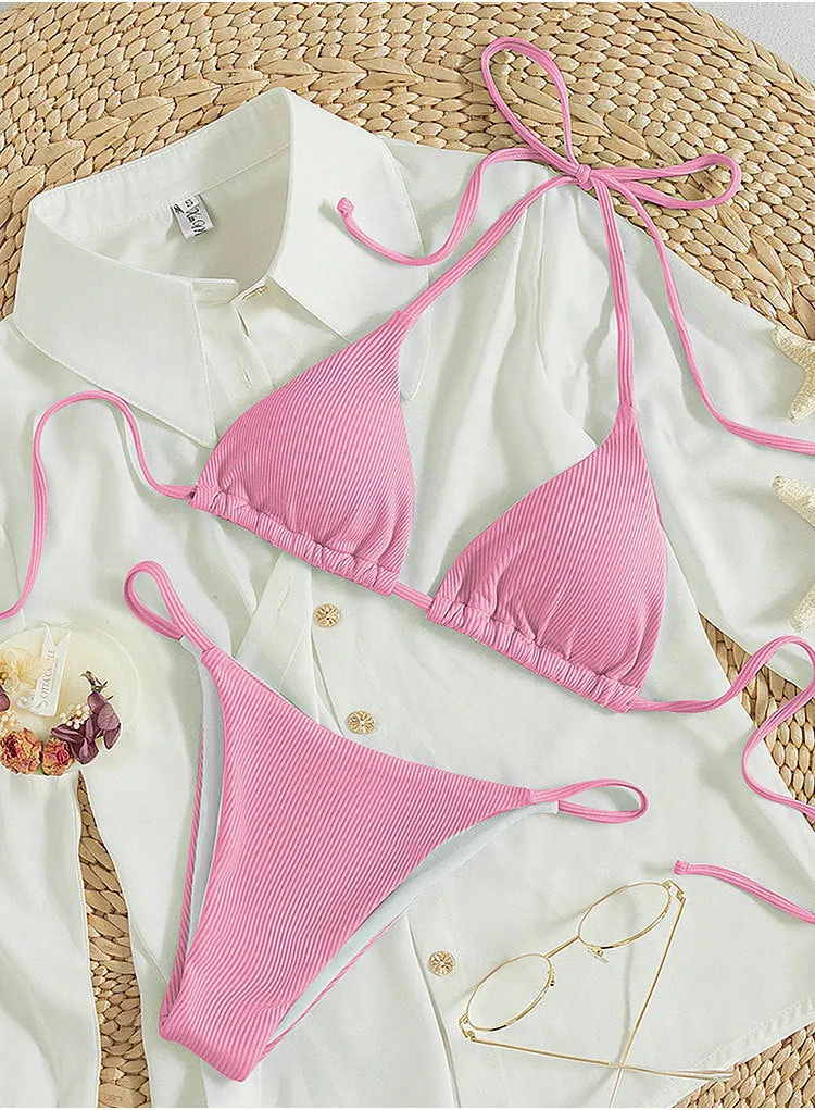 Women's lace up bikini swimsuit in multiple colours on a mannequin, showing front and back design