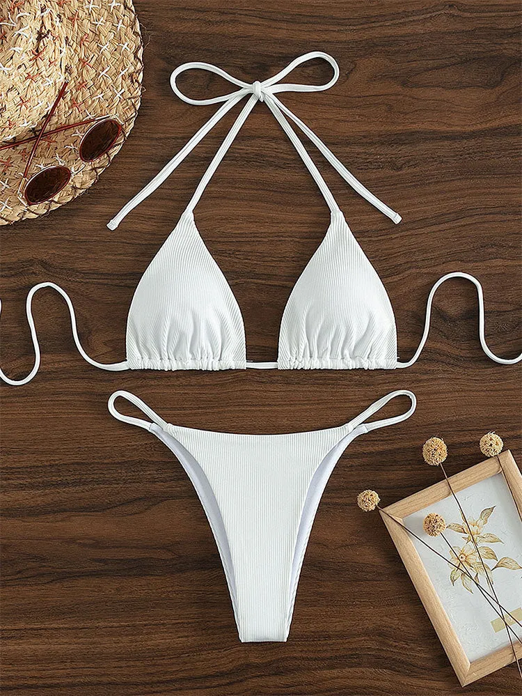 Women's lace up bikini swimsuit in multiple colours on a mannequin, showing front and back design