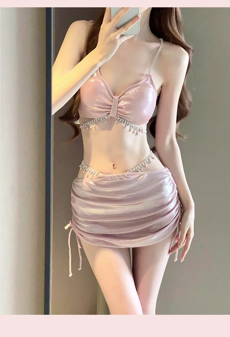 Women's solid colour bikini swimsuit set in black or pink, made from polyester fabric.