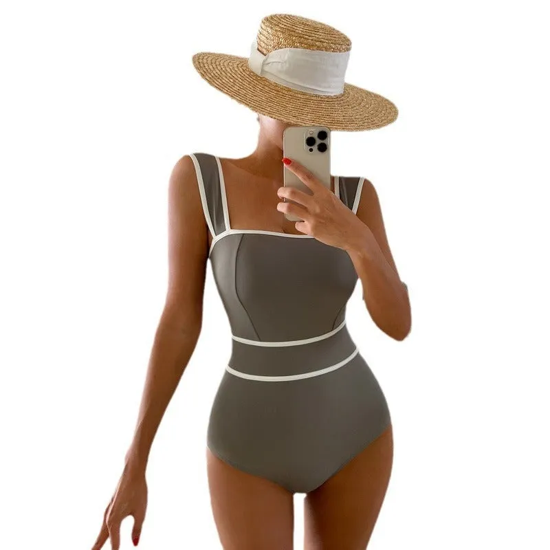 Women's black one-piece swimsuit with lace-up backless design and sleeveless cut