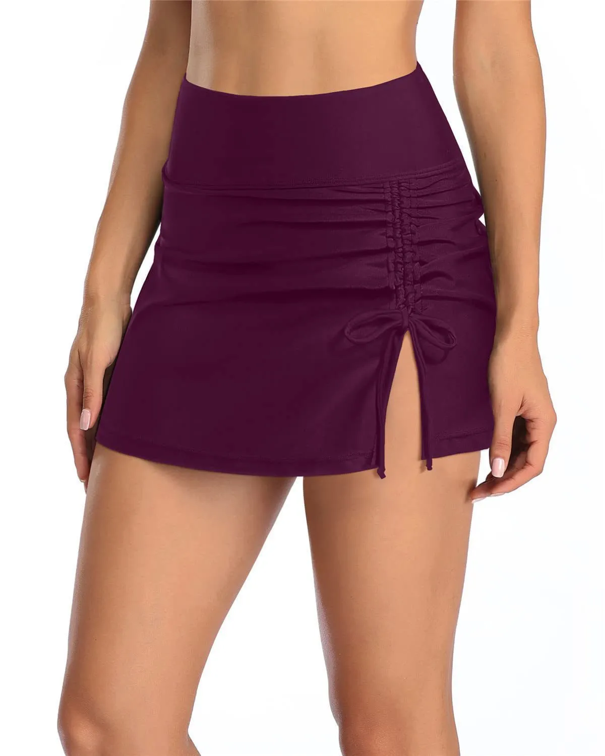Women's solid colour swimming trunks with lace detail on polyester fabric.