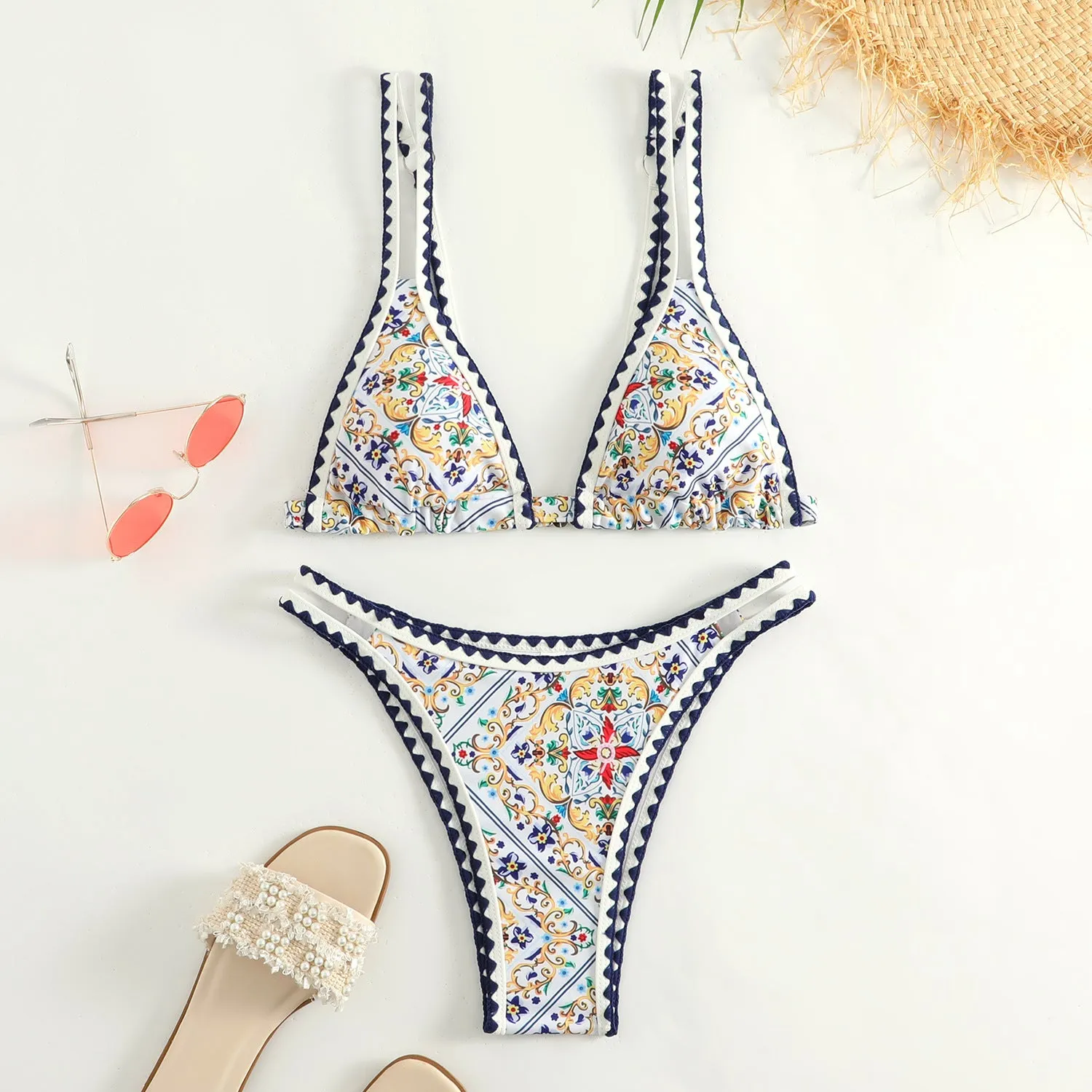 Women's floral print bikini swimsuit set with top and briefs, backless design.