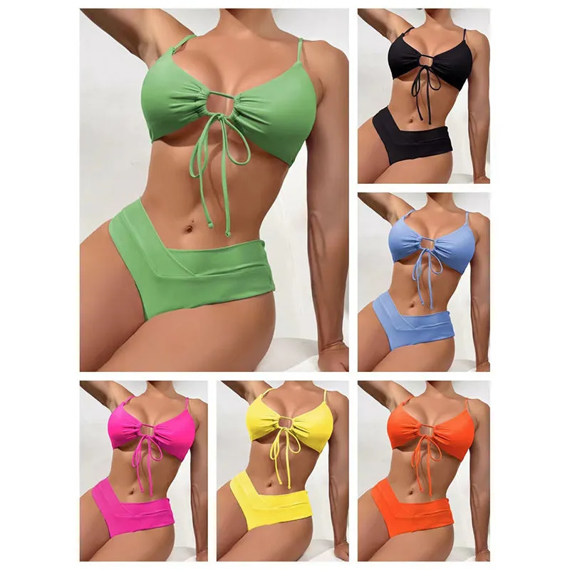 Women's solid colour bikini swimsuit with a tied bow and split leg briefs