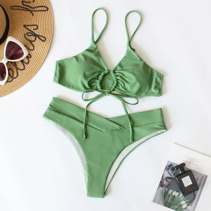 Women's solid colour bikini swimsuit with a tied bow and split leg briefs
