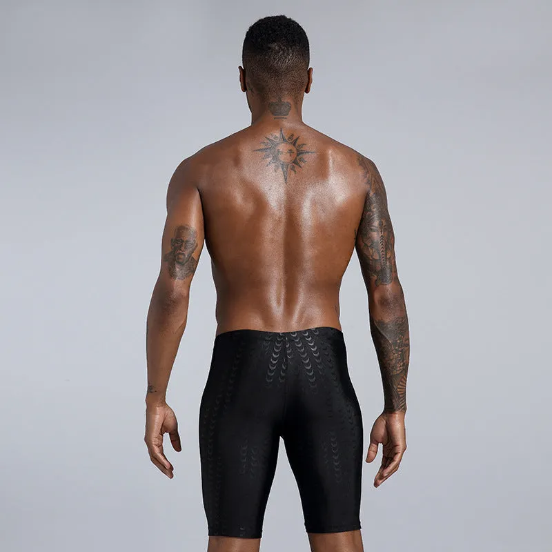 Men's solid colour polyester swimming trunks shown in boxers and cropped pants styles.