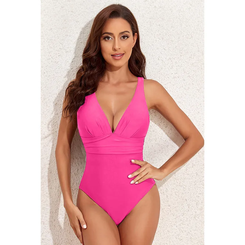 Women's solid colour cross shoulder one-piece nylon swimsuit on a model.
