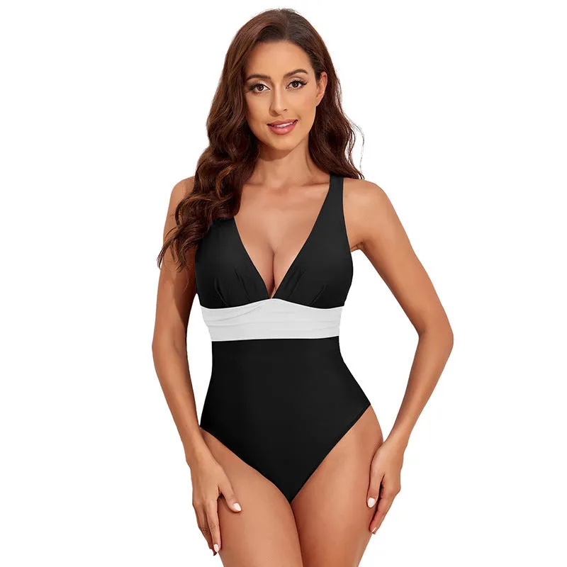Women's solid colour cross shoulder one-piece nylon swimsuit on a model.