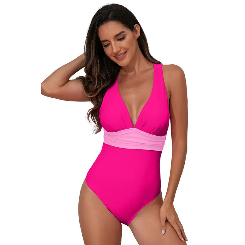 Women's solid colour cross shoulder one-piece nylon swimsuit on a model.
