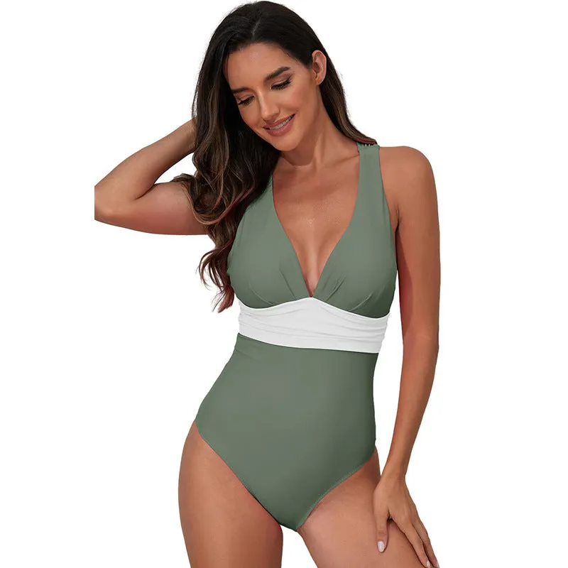 Women's solid colour cross shoulder one-piece nylon swimsuit on a model.