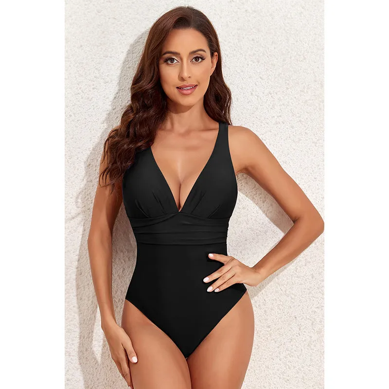 Women's solid colour cross shoulder one-piece nylon swimsuit on a model.