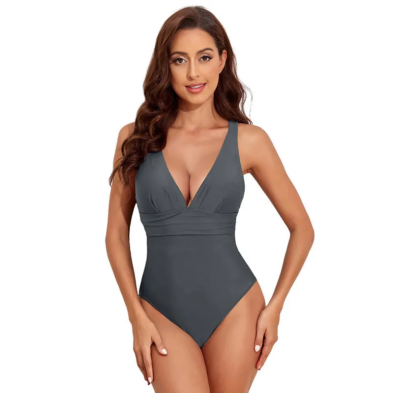 Women's solid colour cross shoulder one-piece nylon swimsuit on a model.