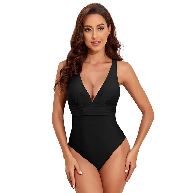Women's solid colour cross shoulder one-piece nylon swimsuit on a model.