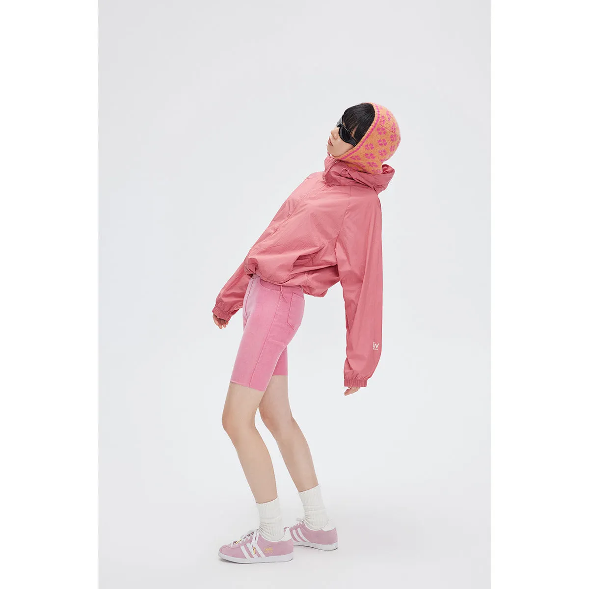 Men's thin hooded sports coat in chemical fibre blend on a hanger.