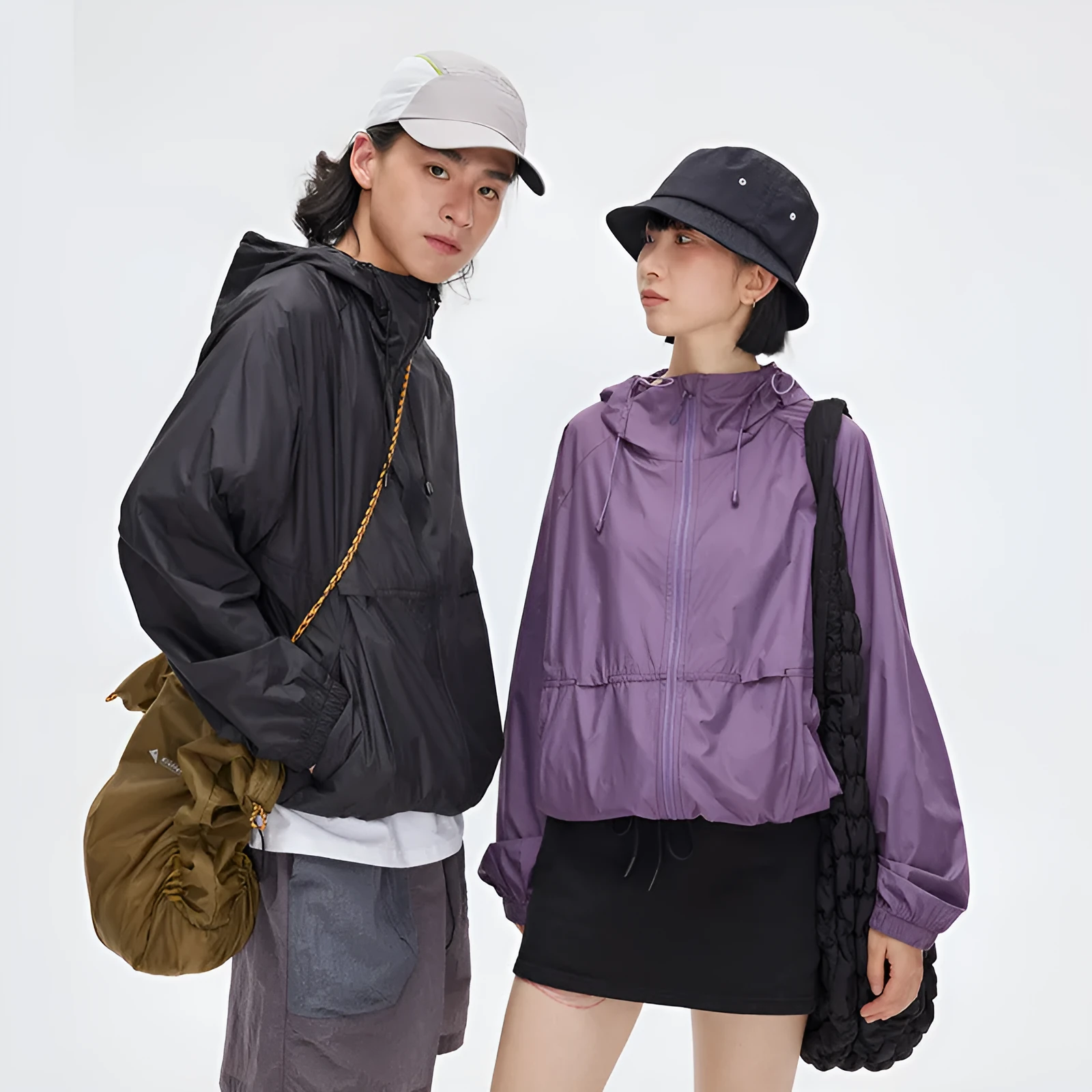 Men's thin hooded sports coat in chemical fibre blend on a hanger.