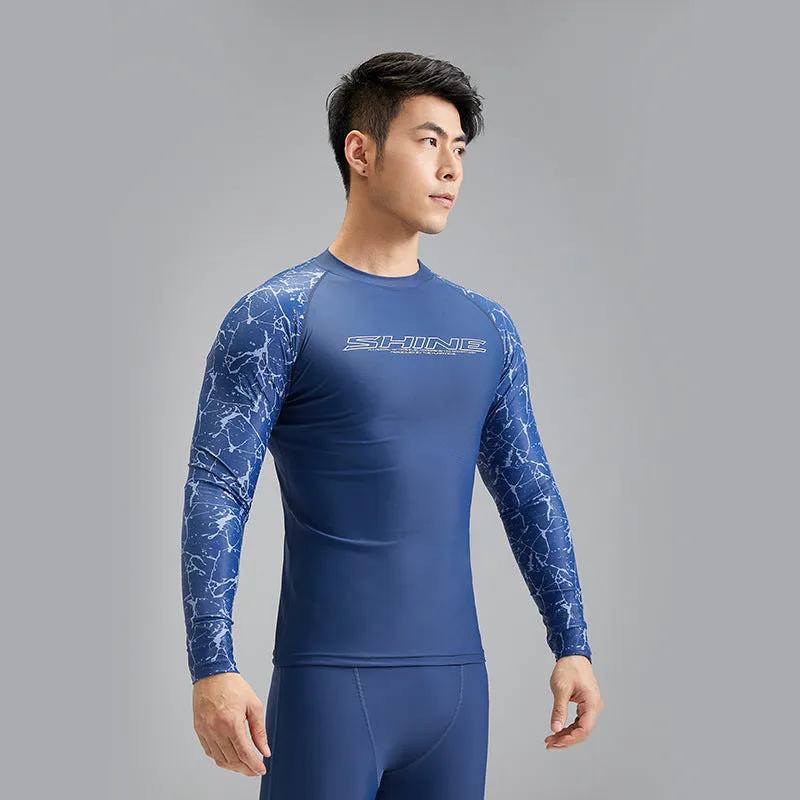 Men's dark blue patterned nylon swimwear set with matching top and trousers