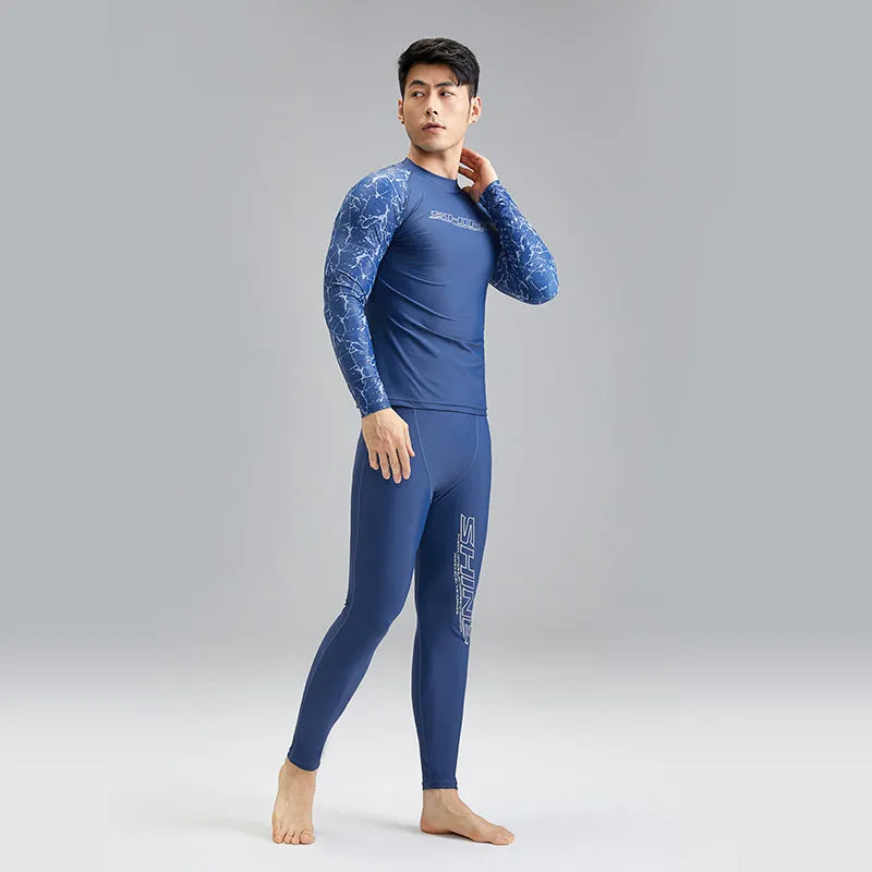 Men's dark blue patterned nylon swimwear set with matching top and trousers