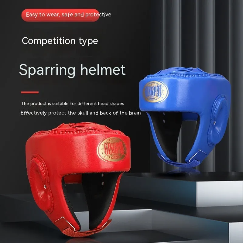 Red fully enclosed boxing helmet with jaw protection showing vertical style design