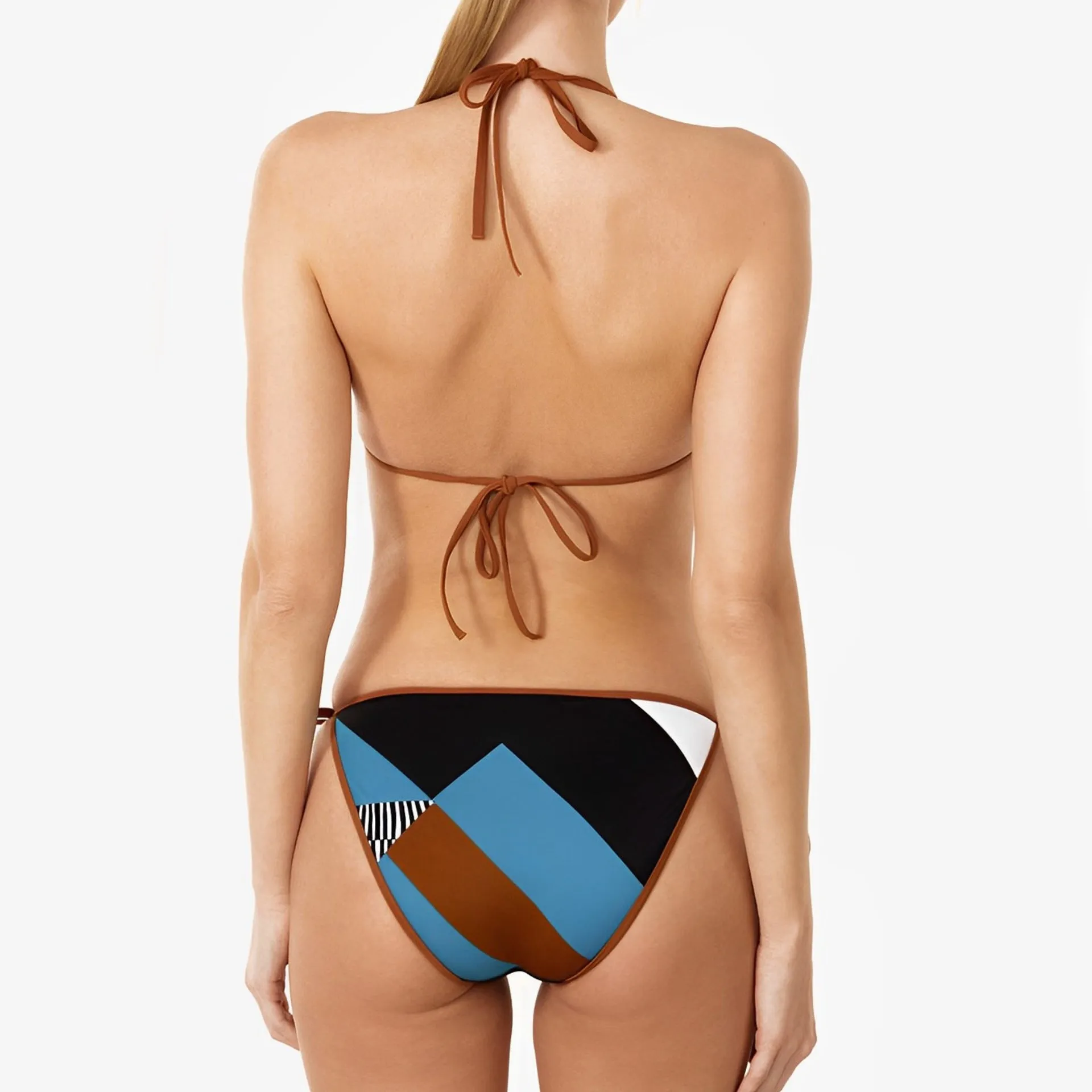 A woman wearing a skinny print, backless polyester bikini set on a beach.