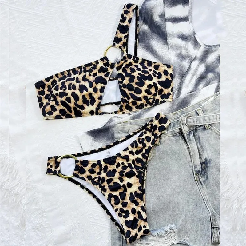Women's hollow leopard print with polka dots bikini top and shorts set on a mannequin.