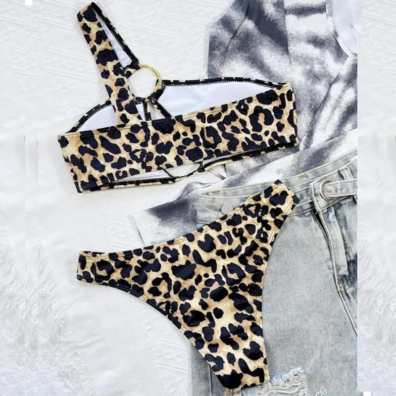 Women's hollow leopard print with polka dots bikini top and shorts set on a mannequin.