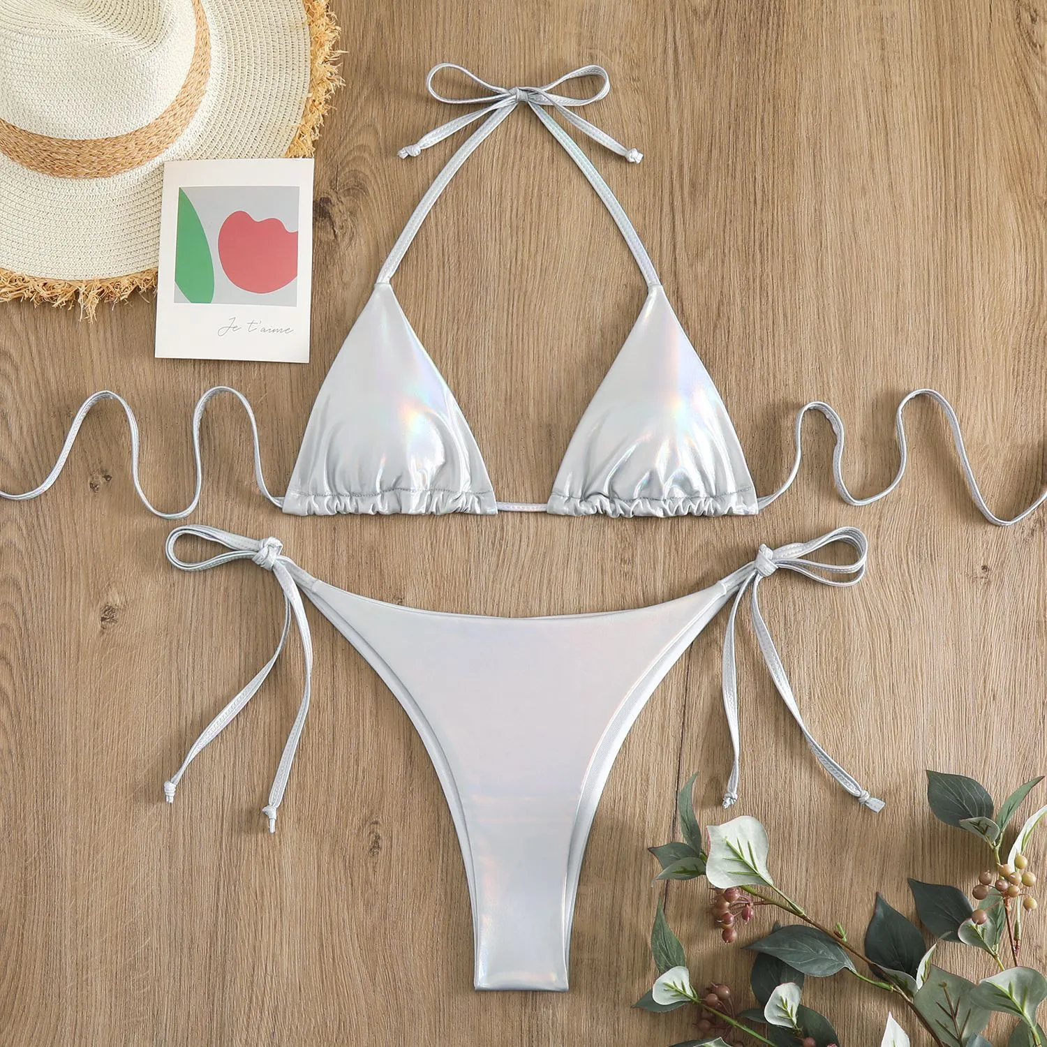 Women's lace-up bikini in metallic colour with adjustable ties and polyester fabric.