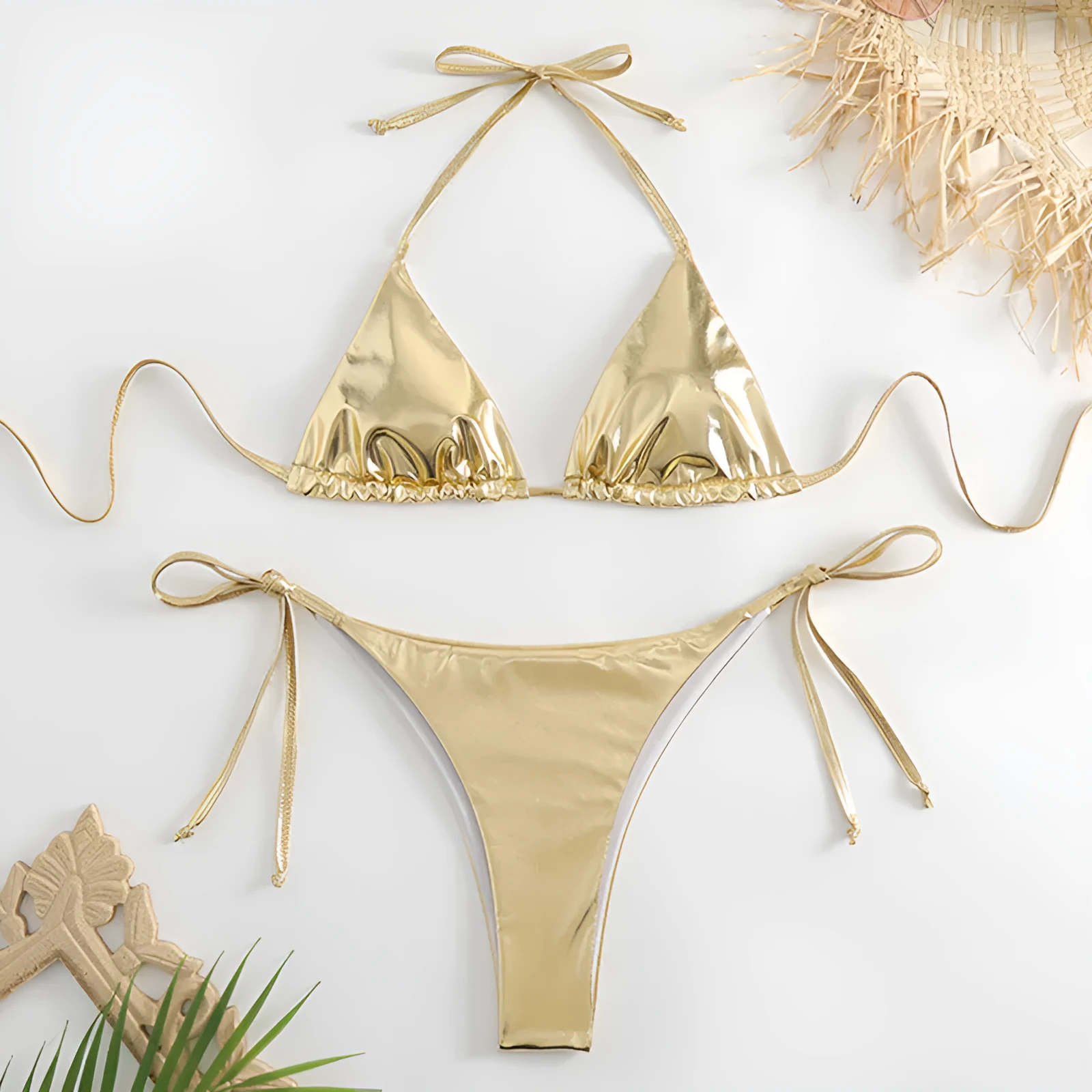 Women's lace-up bikini in metallic colour with adjustable ties and polyester fabric.